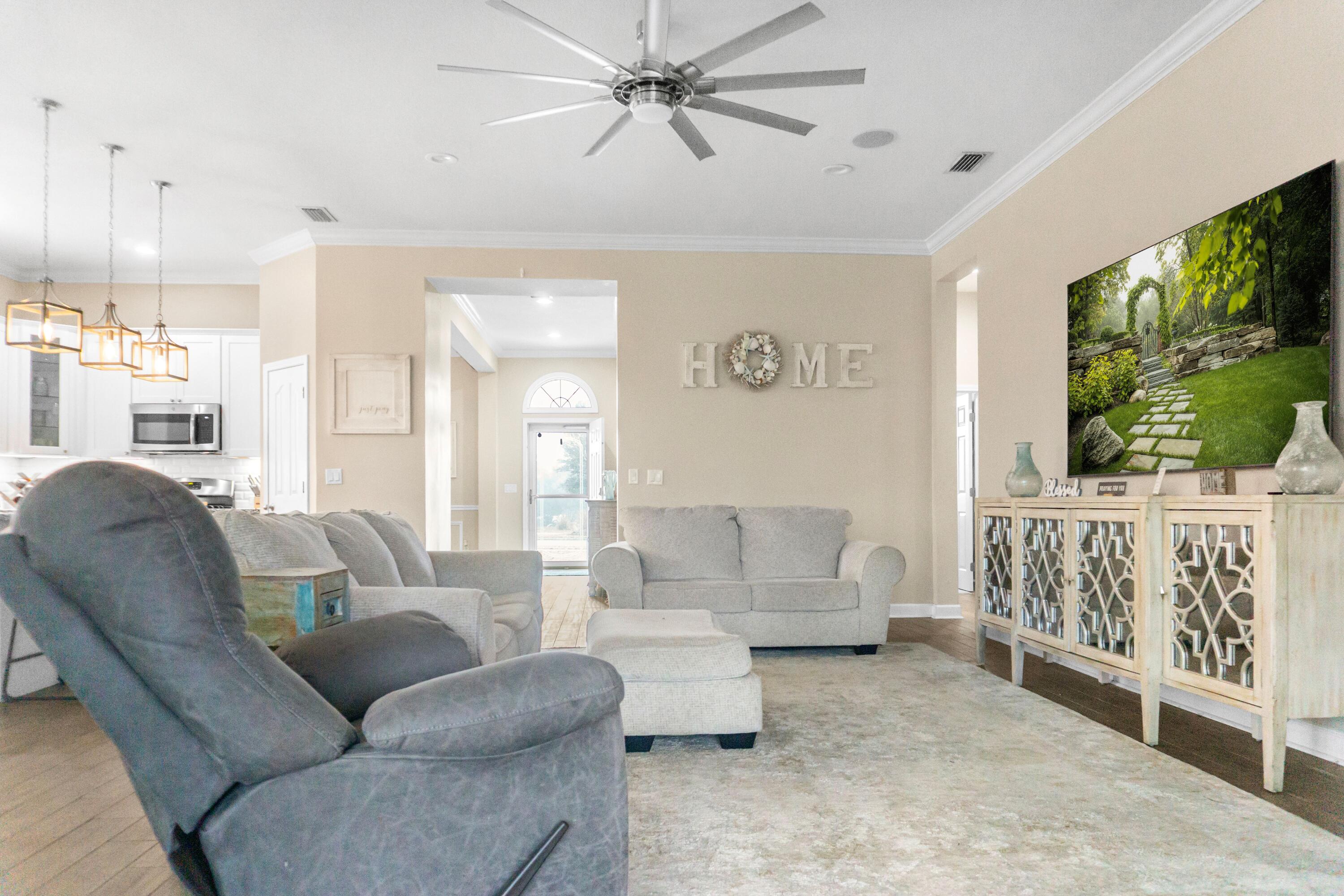 2902 Short Tail Court Panama City, FL 32405 - Photo 9 of 46 a living room with furniture and a large window