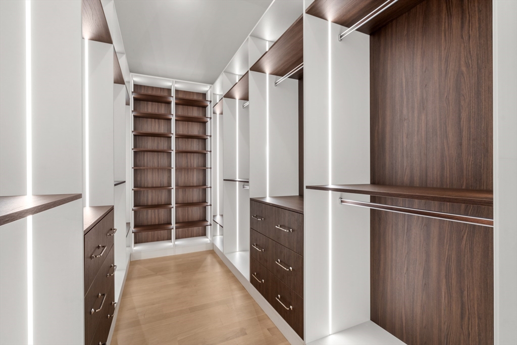 28 Parker Road Wellesley, MA 02482 - Photo 20 of 32 a view of walk in closet with empty racks
