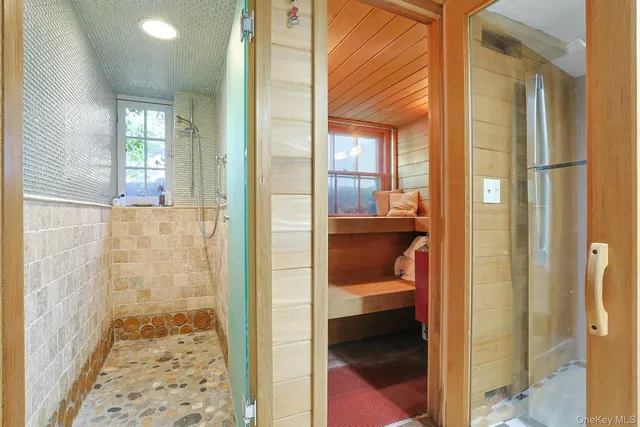 a bathroom with a glass shower door