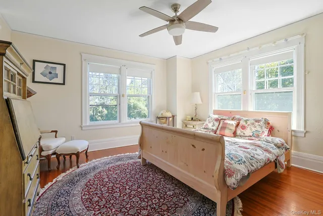 a bathroom with a granite countertop sink a toilet and bathtub