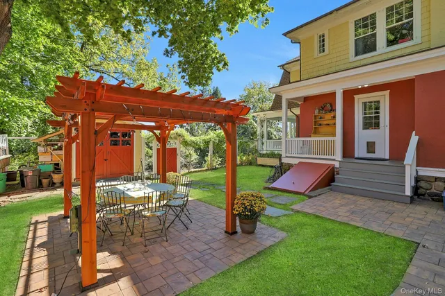 a view of a backyard with sitting area