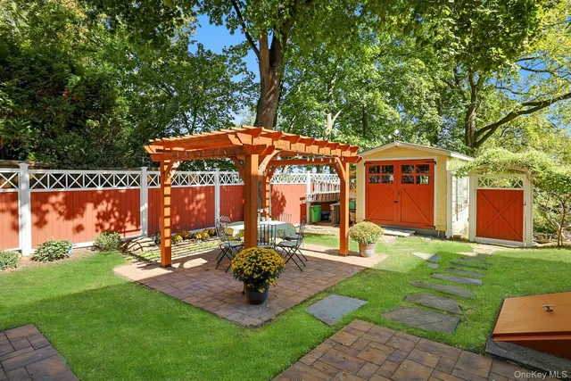 a view of green field with trees in the background