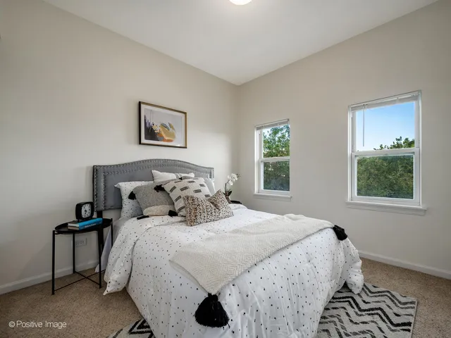 a bedroom with bed and window