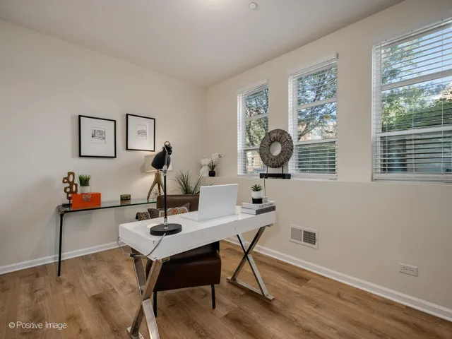 a work room with furniture and window