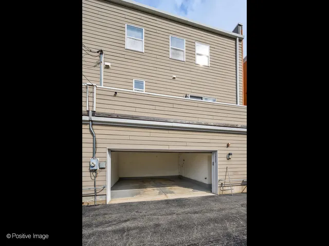a view of empty room with a fireplace
