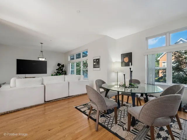 a view of a livingroom with furniture and a flat screen tv