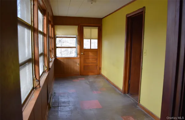 a view of an empty room with a window