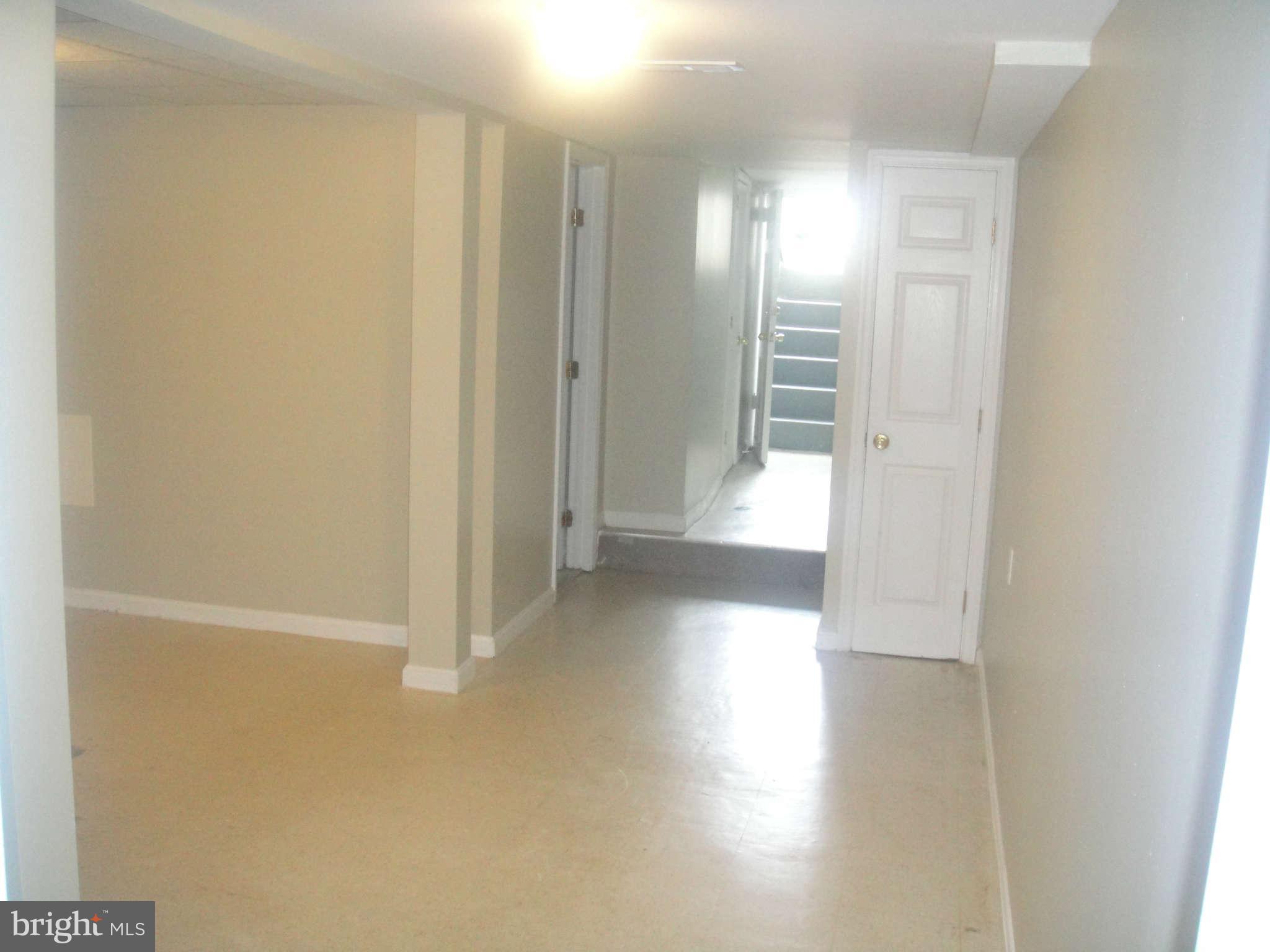 625 Columbia Road Northwest Washington, DC 20001 - Photo 24 of 26 a view of a hallway with wooden floor