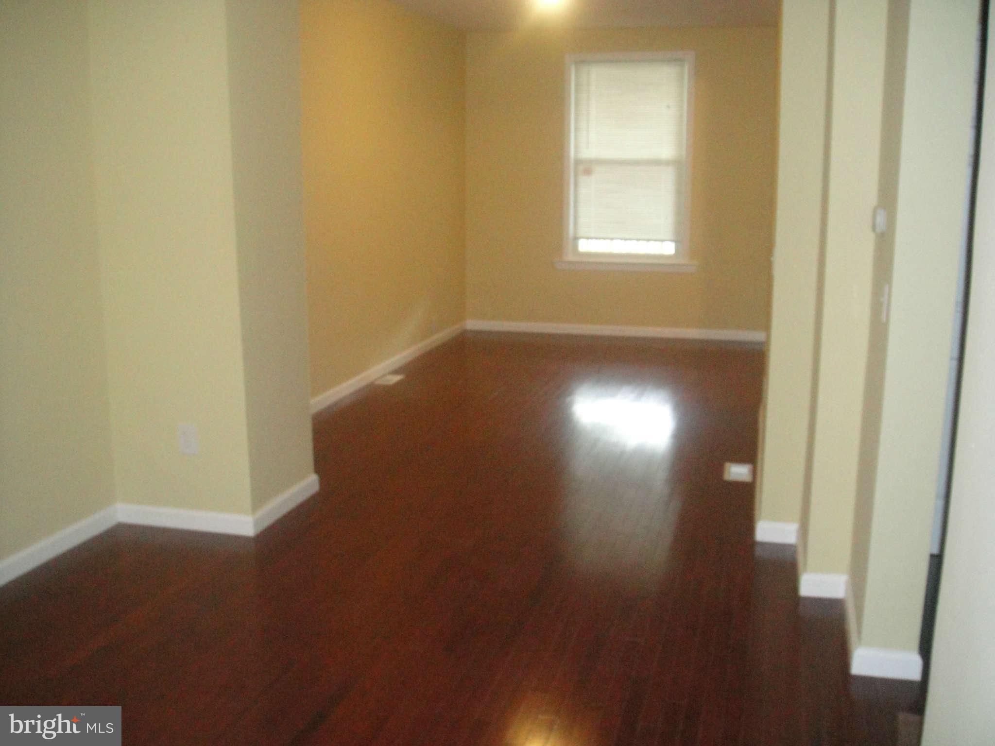 625 Columbia Road Northwest Washington, DC 20001 - Photo 8 of 26 a view of room with window and hardwood floor
