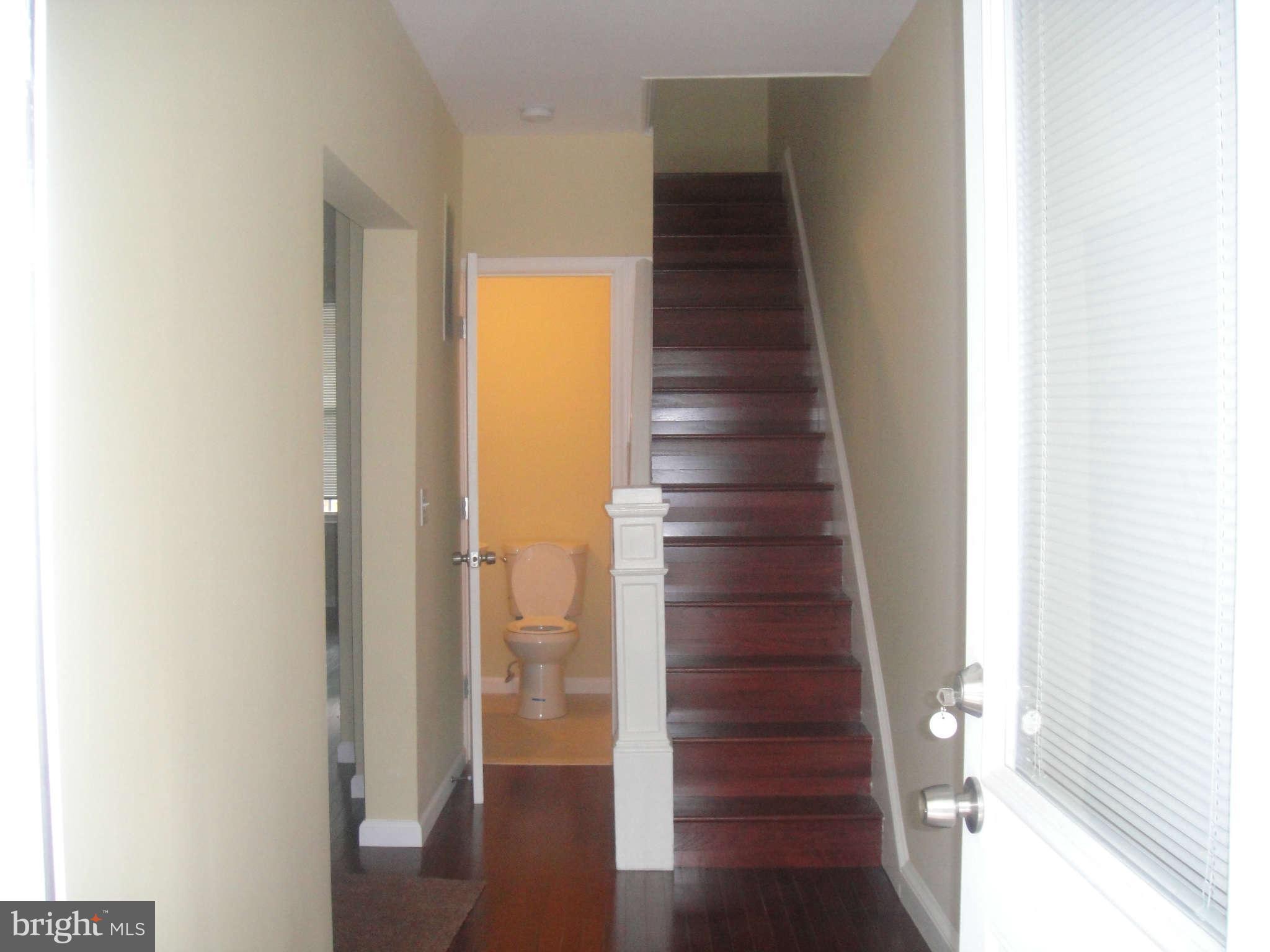 625 Columbia Road Northwest Washington, DC 20001 - Photo 10 of 26 a view of entryway and hall with wooden floor