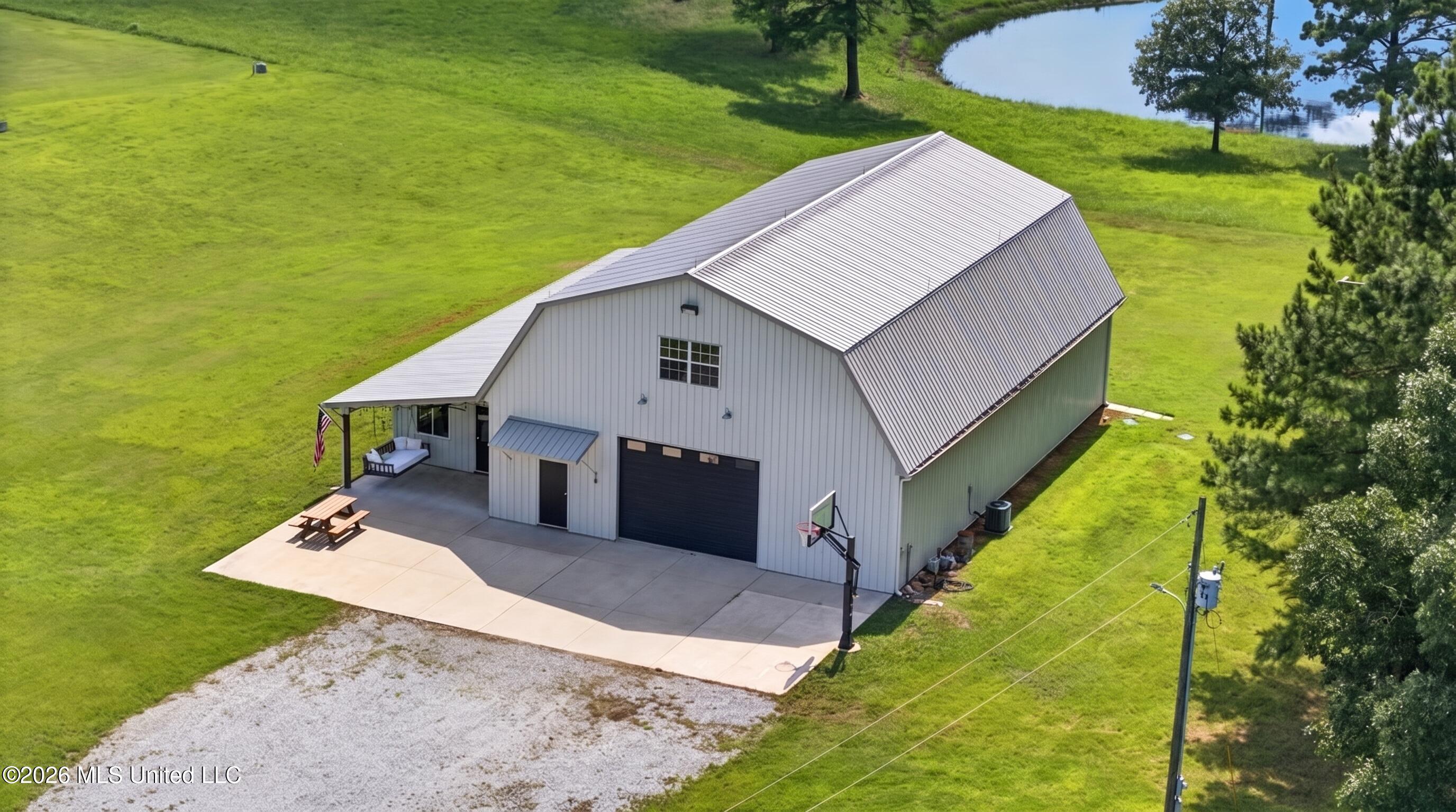 523 North Slayden Road Lamar, MS 38642 - Photo 2 of 51 Barn drone (golf cart removed)
