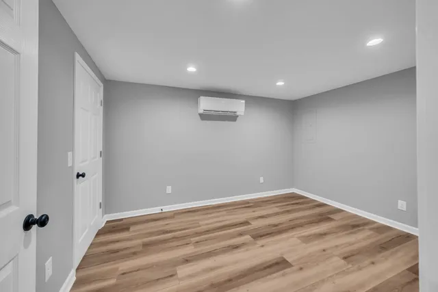 a view of wooden floor in an empty room