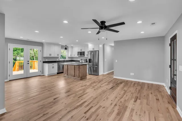 a view of a kitchen with a sink and a stove top oven