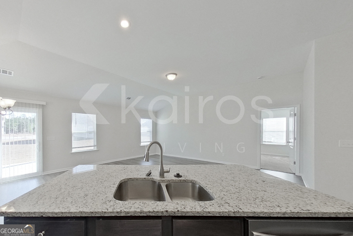 109 Bluff Road Springfield, GA 31329 - Photo 6 of 21 a bathroom with a granite countertop sink and a mirror