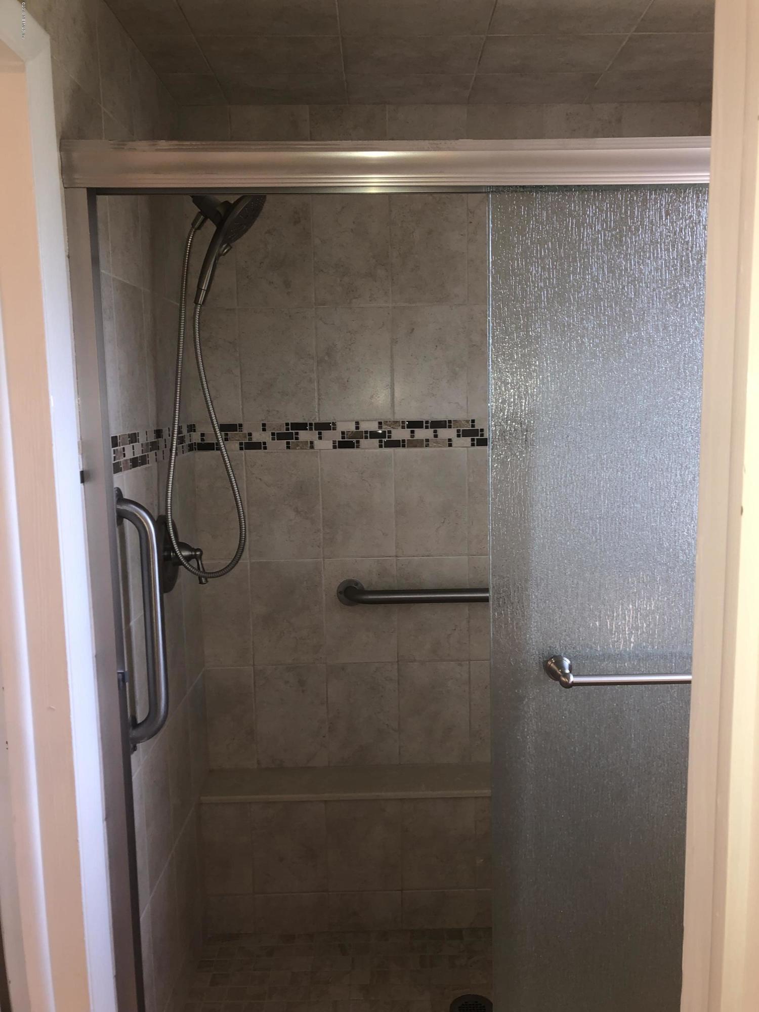2422 Provost Road East Jacksonville, FL 32216 - Photo 12 of 18 a close view of a shower in a bathroom