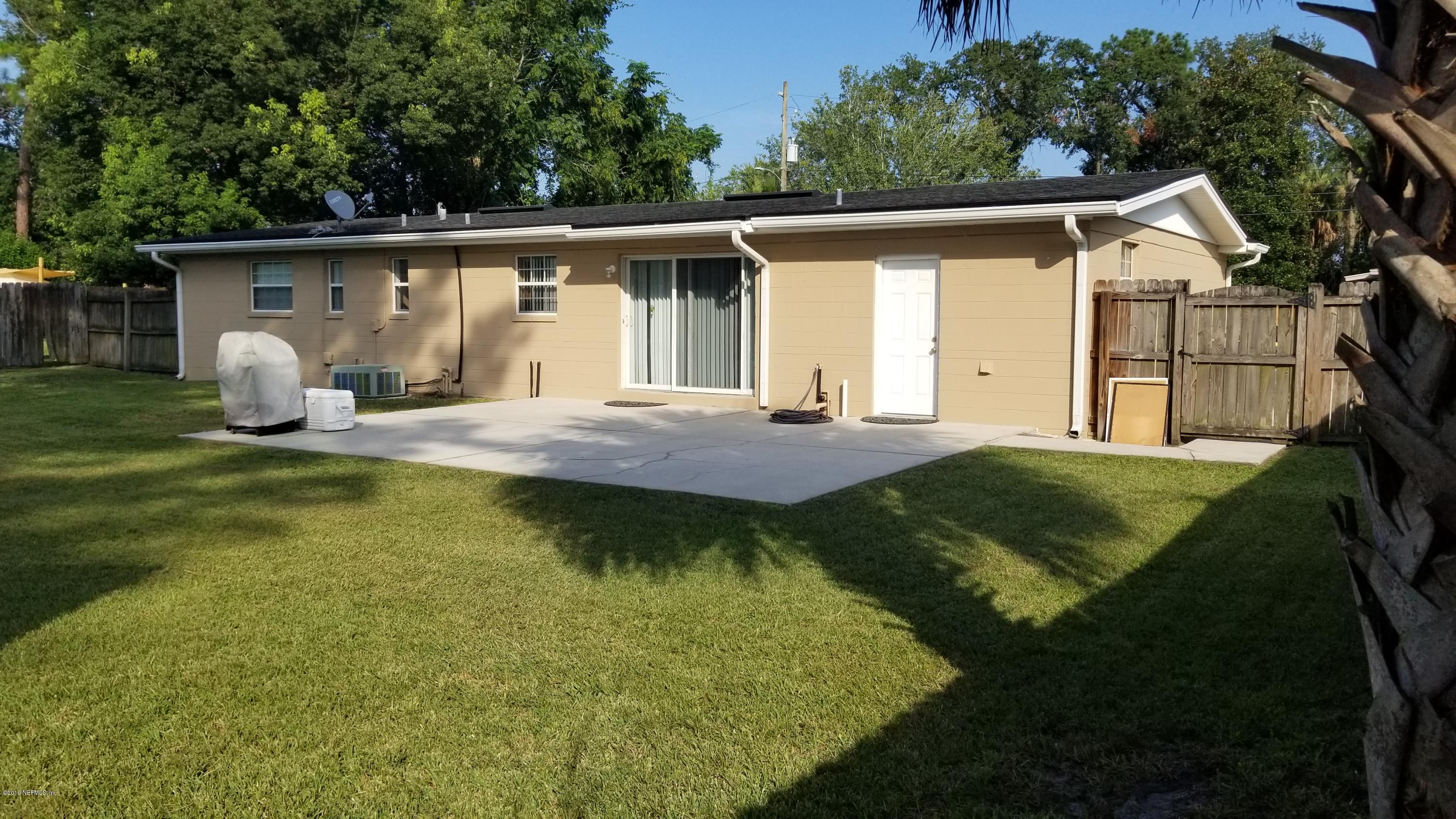 2422 Provost Road East Jacksonville, FL 32216 - Photo 16 of 18 a view of a house with backyard and sitting area