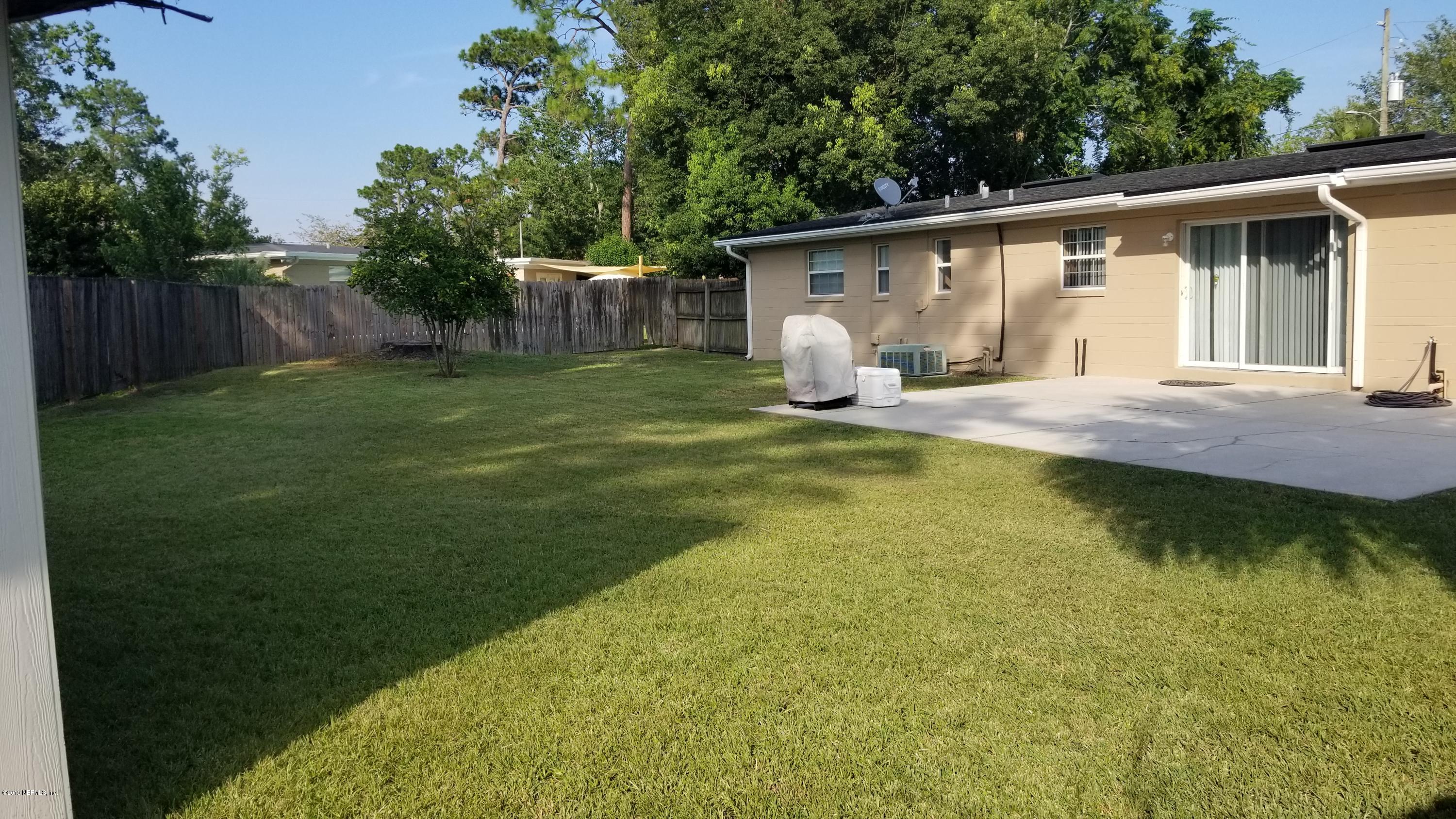 2422 Provost Road East Jacksonville, FL 32216 - Photo 17 of 18 a view of a house with backyard and sitting area