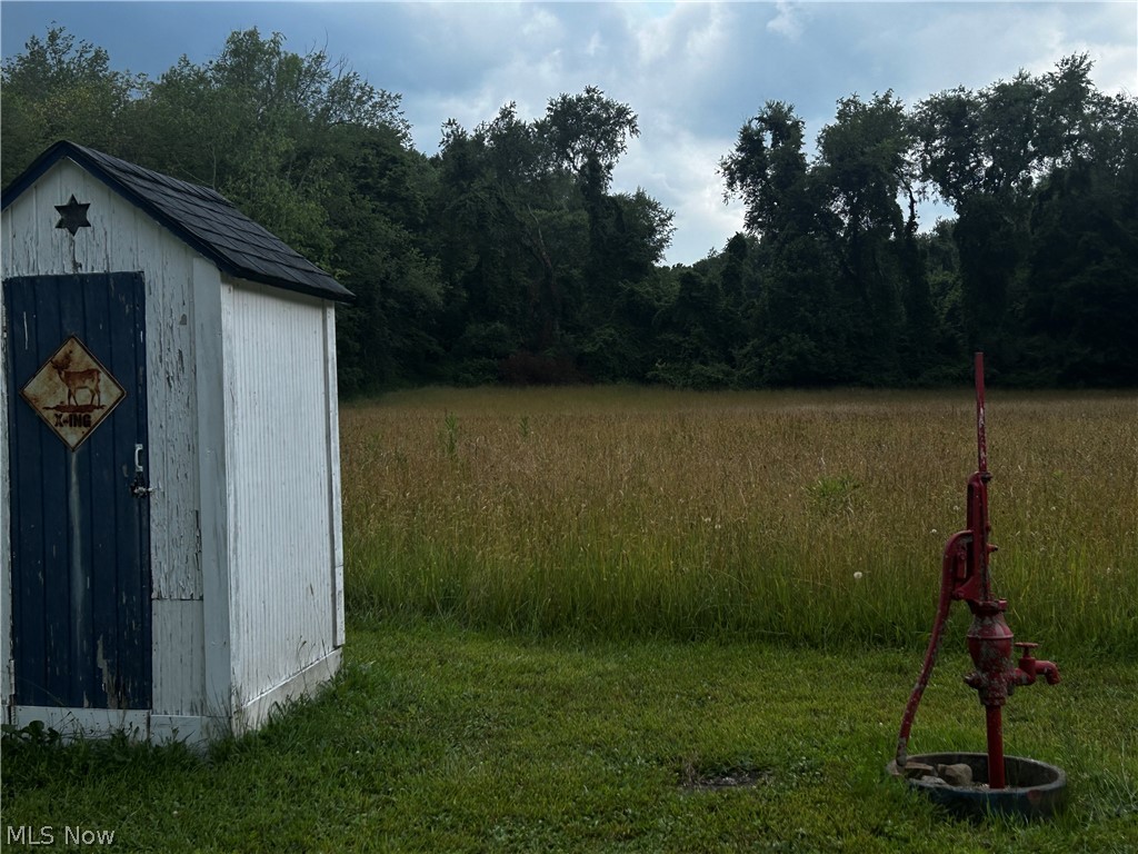 5742 Grove Road Clinton, OH 44216 - Photo 20 of 37 Outhouse & Working Water Pump