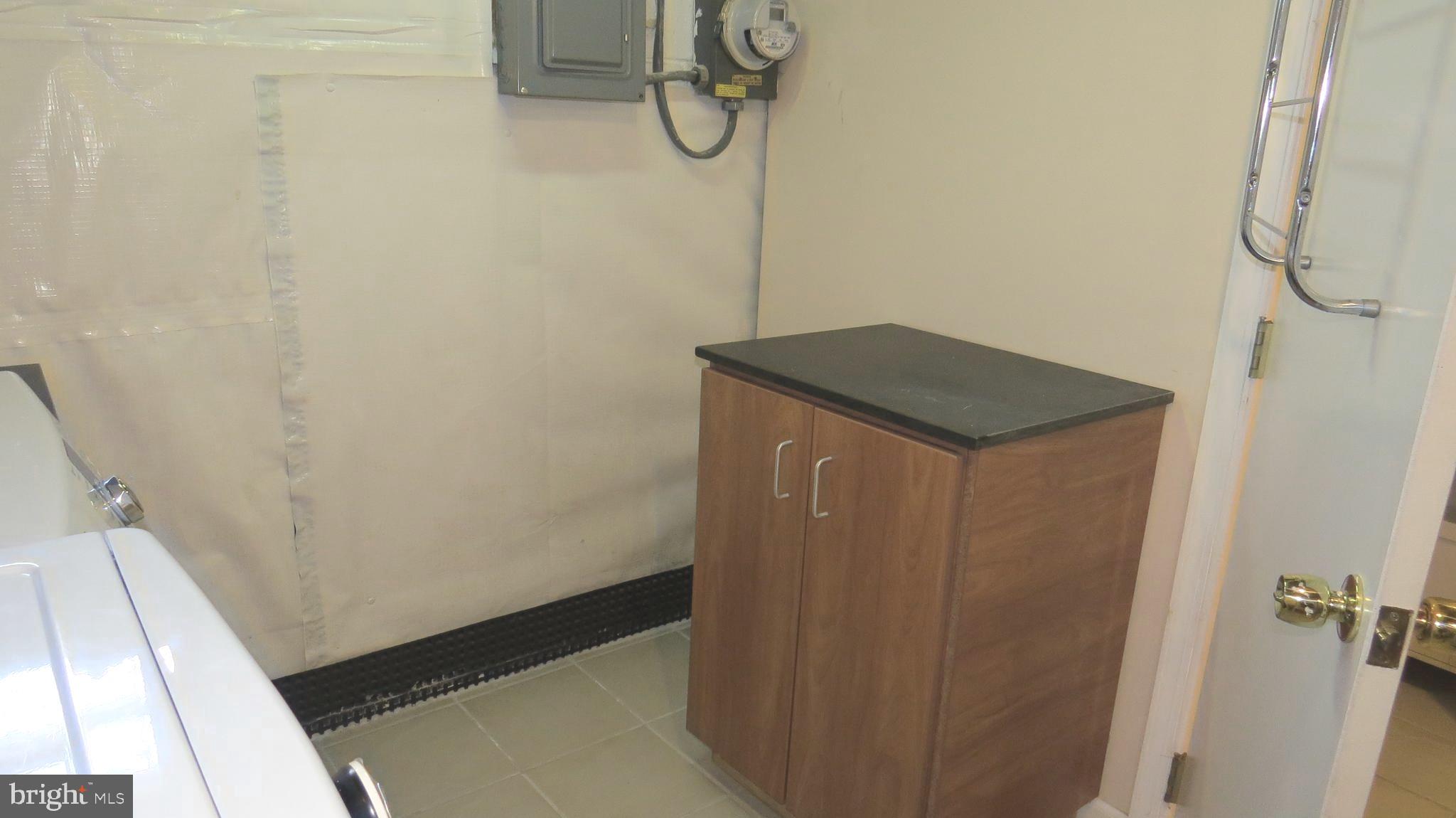 2220 Graythorn Road Baltimore, MD 21220 - Photo 45 of 63 Workspace and storage in laundry area