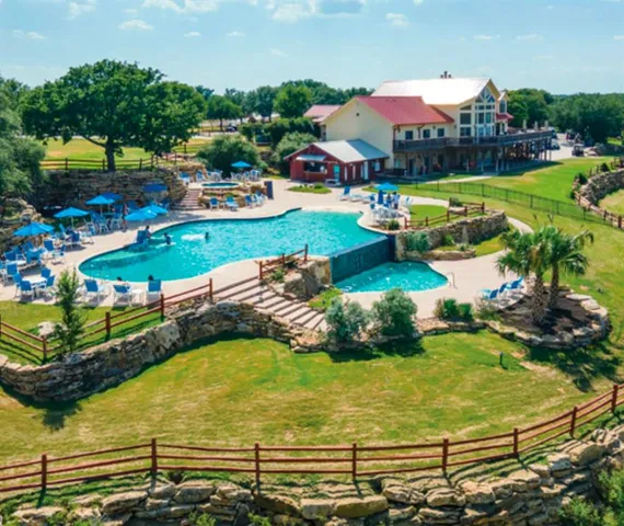 an aerial view of a pool patio swimming pool and outdoor seating