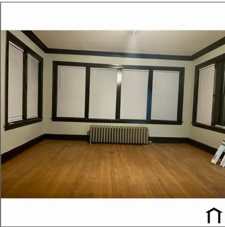 a black and white photo of a living room