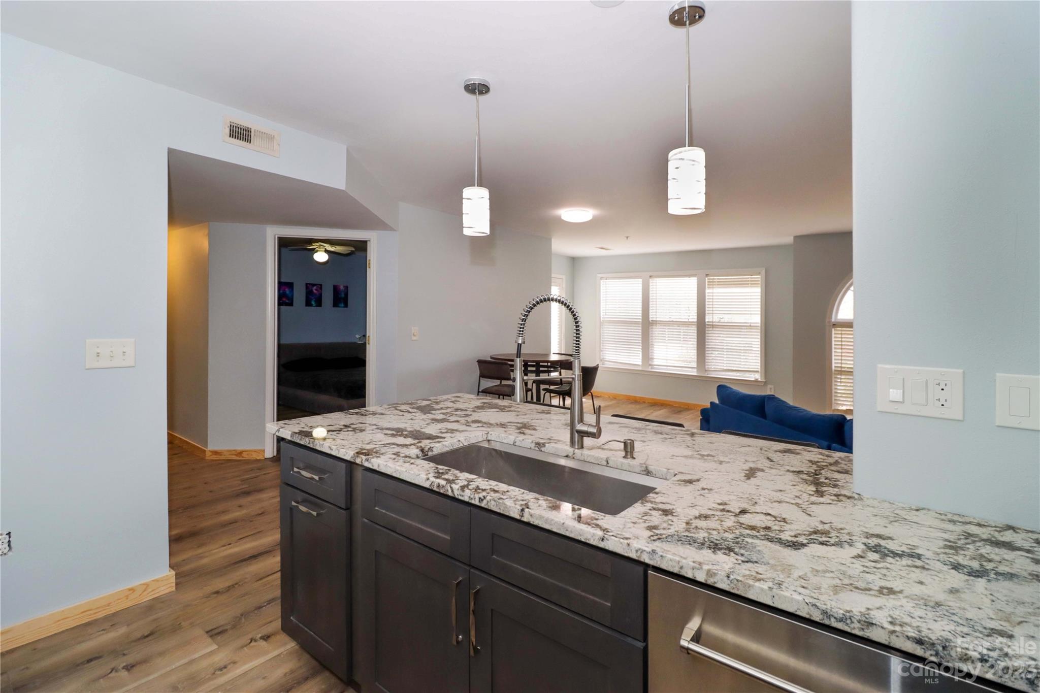 160 James Road, Unit 1D High Point, NC 27265 - Photo 15 of 33 a view of a kitchen with a sink and wooden floor