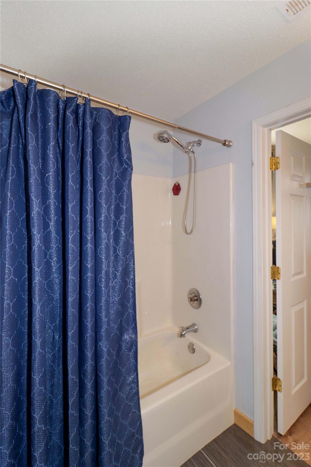 160 James Road, Unit 1D High Point, NC 27265 - Photo 23 of 33 a bathroom with a tub a sink and a shower