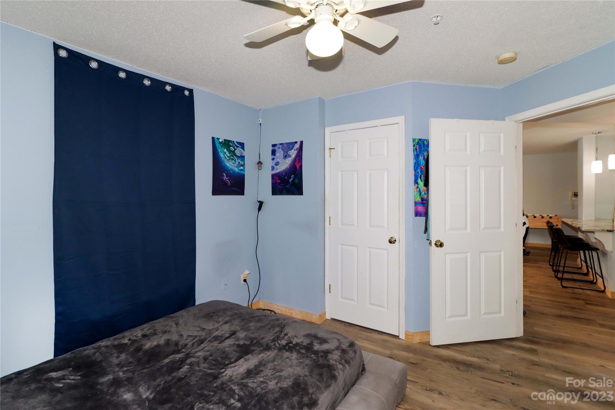 160 James Road, Unit 1D High Point, NC 27265 - Photo 25 of 33 a bedroom with a bed and a chandelier