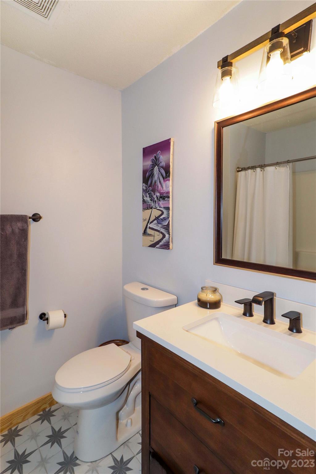 160 James Road, Unit 1D High Point, NC 27265 - Photo 27 of 33 a bathroom with a sink mirror vanity and toilet