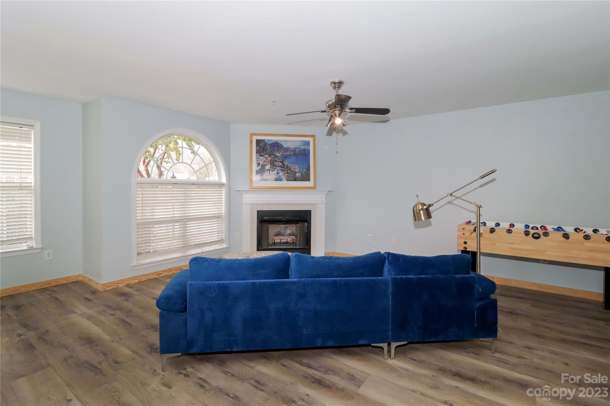 160 James Road, Unit 1D High Point, NC 27265 - Photo 5 of 33 a living room with furniture a fireplace and a large window
