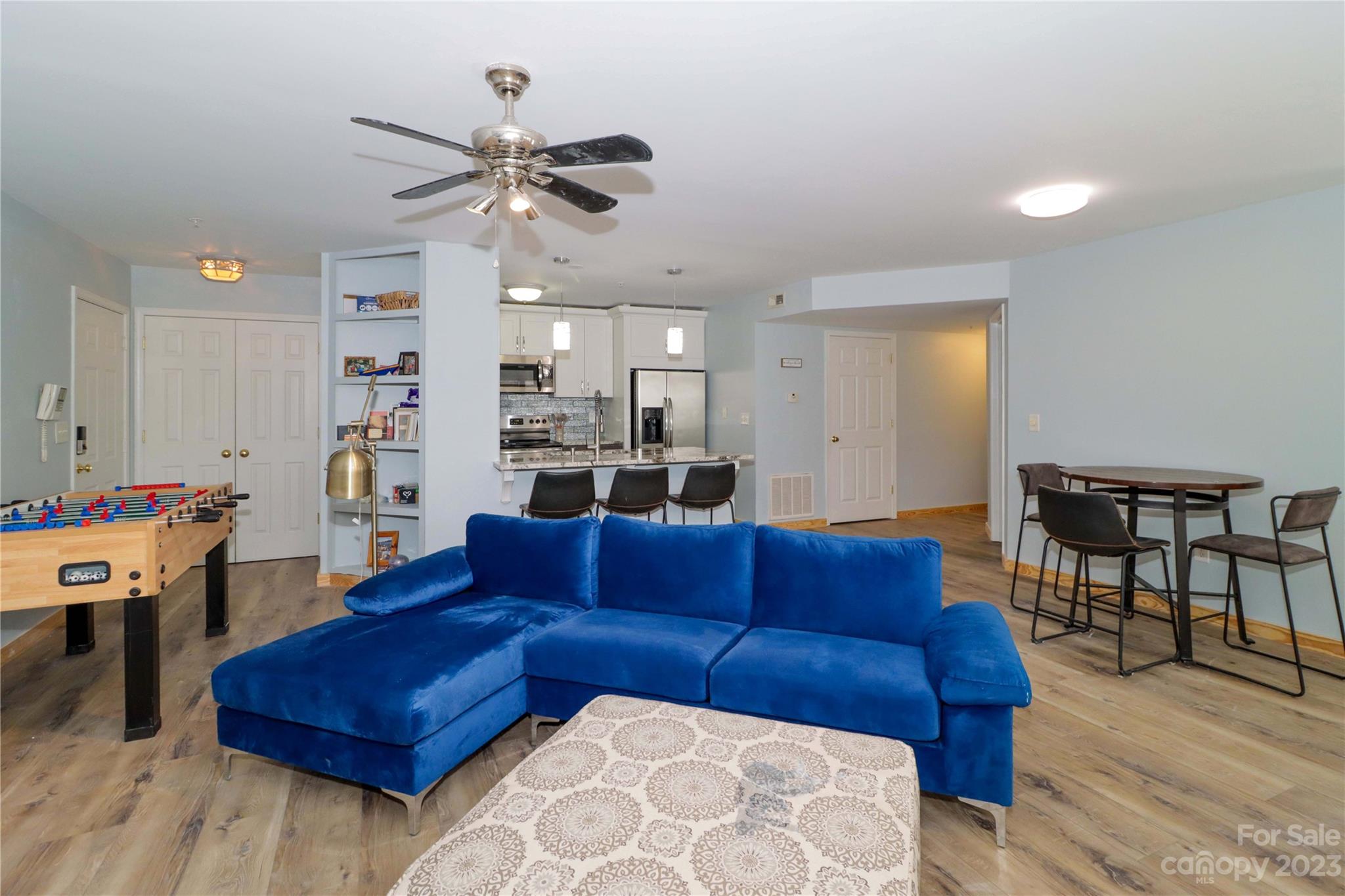 160 James Road, Unit 1D High Point, NC 27265 - Photo 6 of 33 a living room with furniture kitchen view and a chandelier