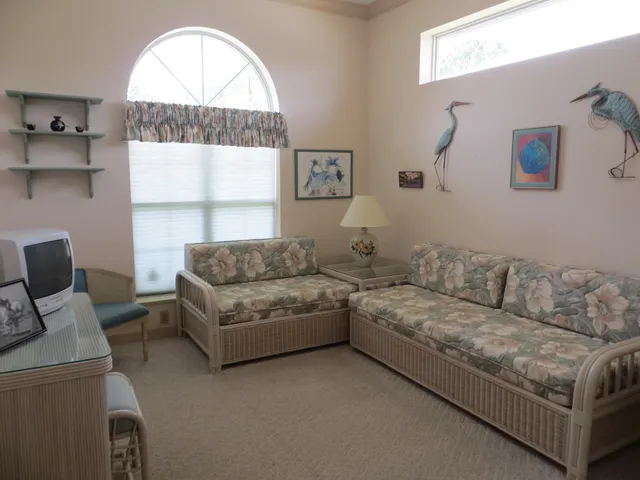 a living room with a couch and a window