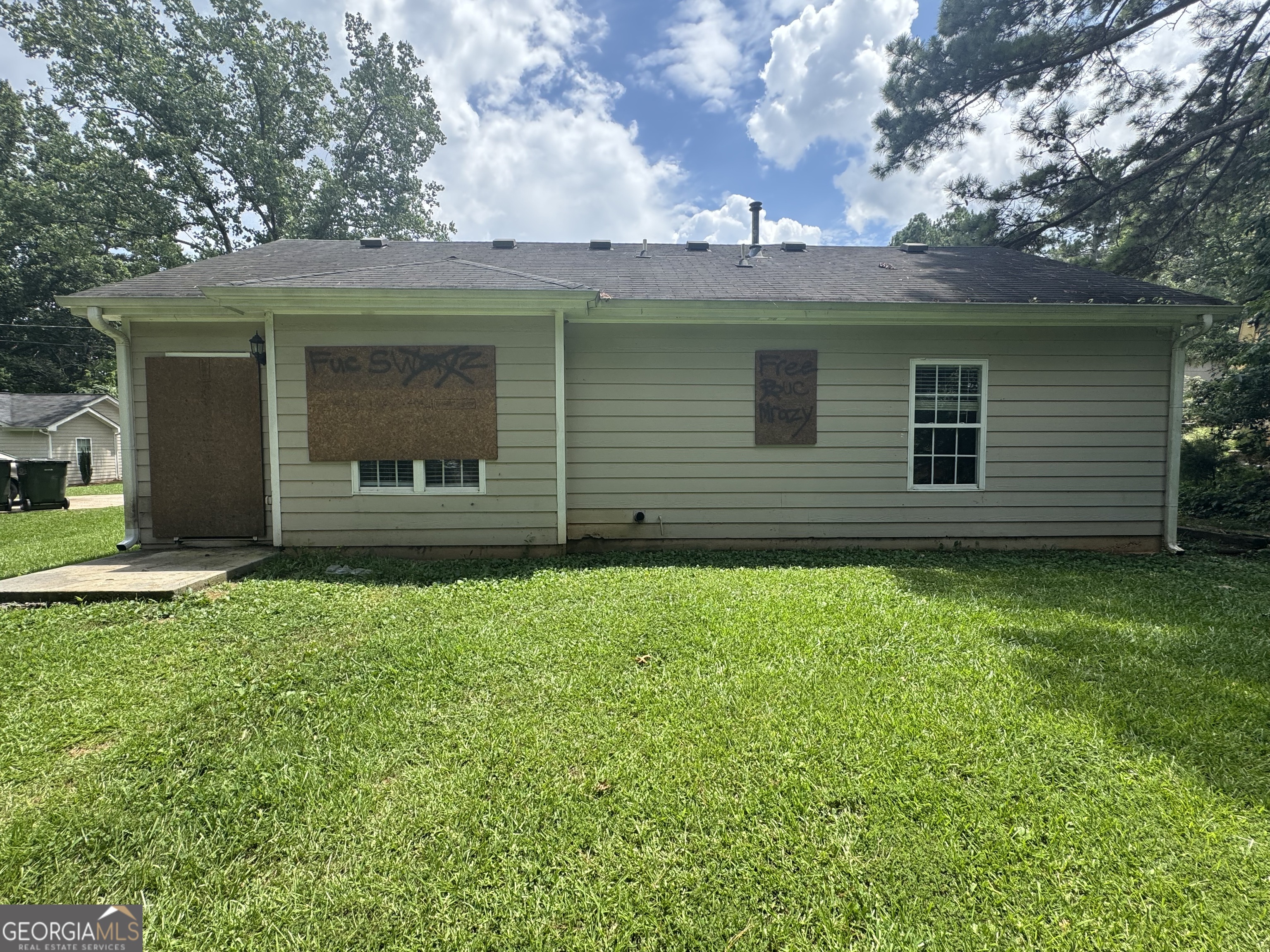 9102 Morris Drive Southwest Covington, GA 30014 - Photo 3 of 3 a view of a house with a garden