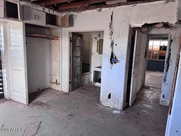 a view of a hallway with a room