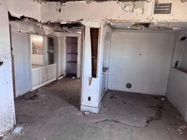 an empty room with a fireplace