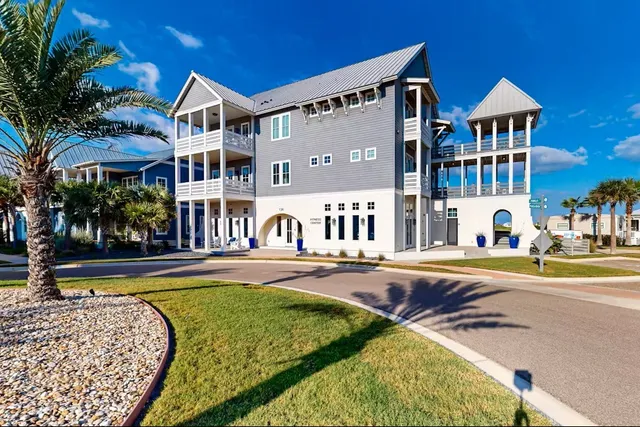 a view of a house with swimming pool and sitting area