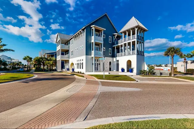 a view of a house with a swimming pool and a yard