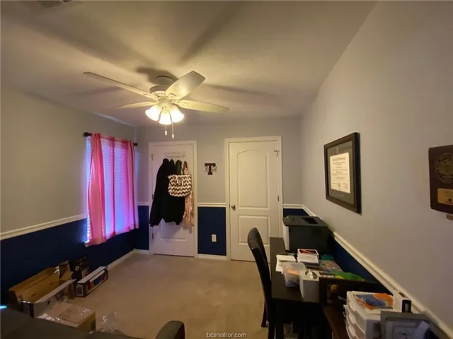 a kitchen with a sink dishwasher a refrigerator and cabinets with wooden floor