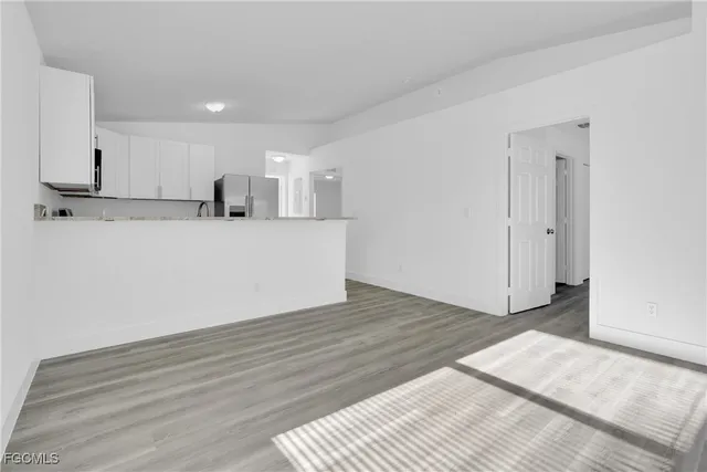a view of kitchen with wooden floor