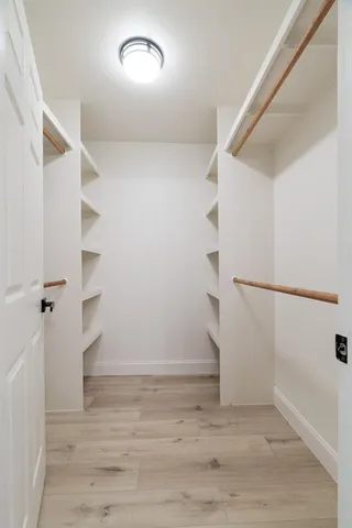 a view of an empty walk in closet