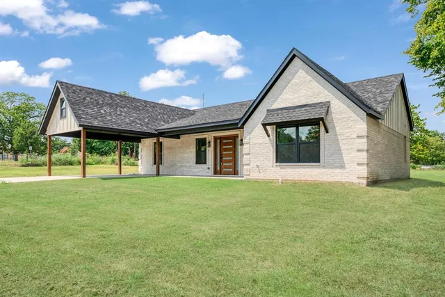 a view of a house with a backyard and porch