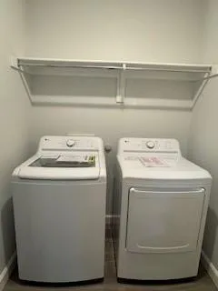 a utility room with washer and dryer