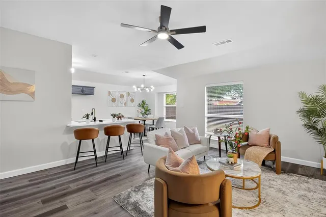 a dining room with furniture and window