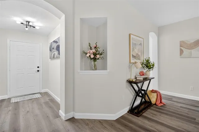 a view of a workspace with wooden floor
