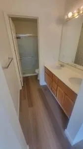 a bathroom with a double vanity sink and a mirror
