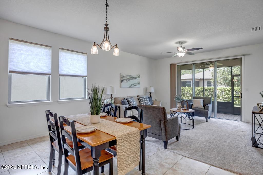 265 Caspia Lane Ponte Vedra, FL 32081 - Photo 17 of 86 a view of a dining room with furniture window and outside view