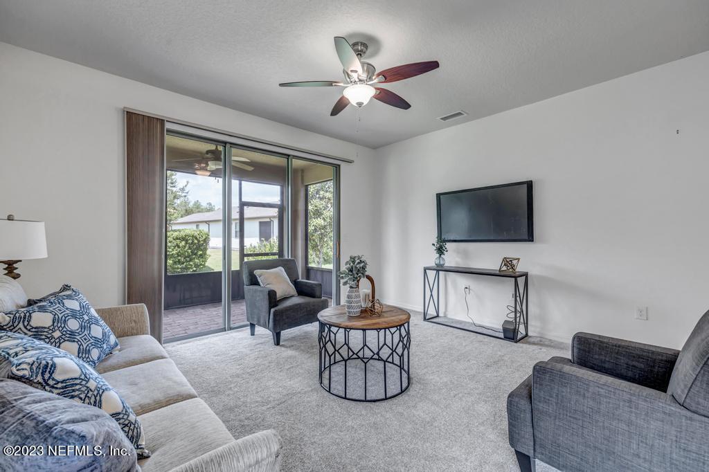 265 Caspia Lane Ponte Vedra, FL 32081 - Photo 18 of 86 a living room with furniture and a flat screen tv