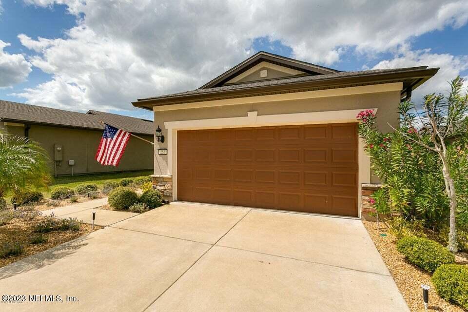 265 Caspia Lane Ponte Vedra, FL 32081 - Photo 2 of 86 a front view of a house with garden