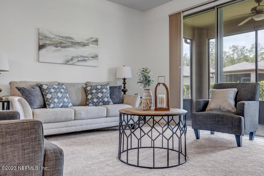 265 Caspia Lane Ponte Vedra, FL 32081 - Photo 22 of 86 a living room with furniture and a large window