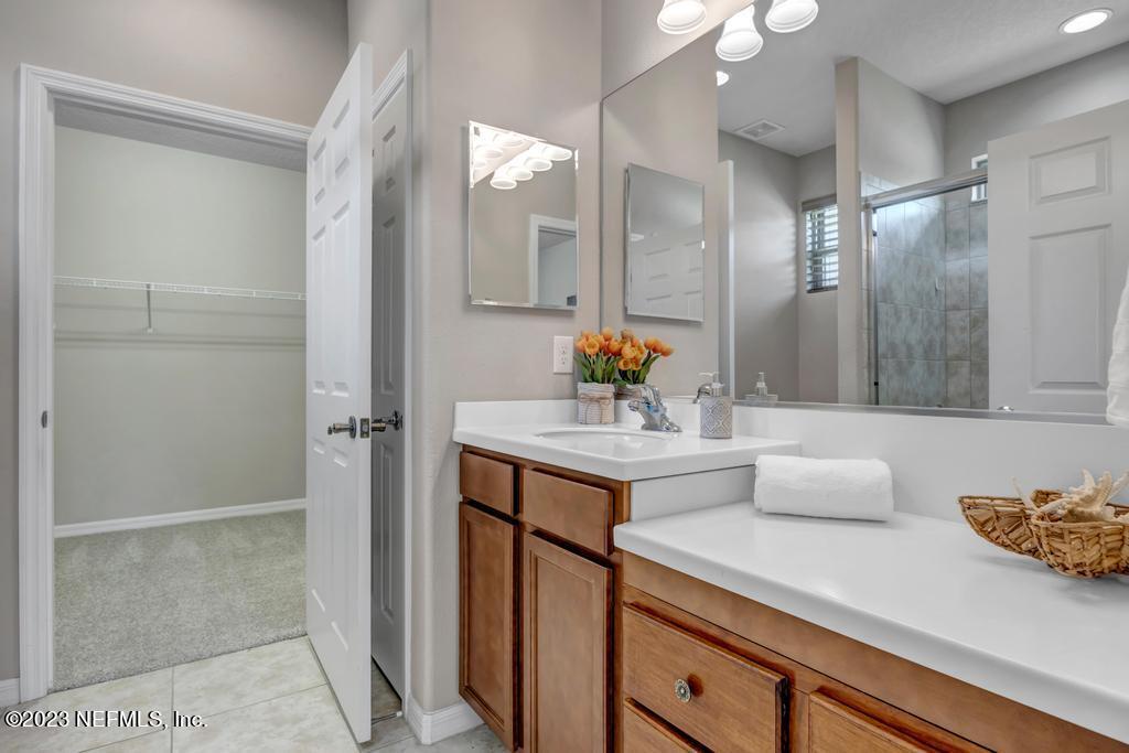 265 Caspia Lane Ponte Vedra, FL 32081 - Photo 26 of 86 a bathroom with a sink and a mirror